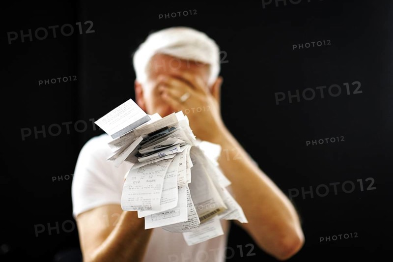 The subject of taxes. A man holds receipts in his hand in Berlin, 09/08/2024