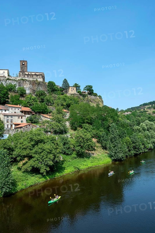 Canoeing at the foot of Chilhac village along the Allier River in Haute-Loire, Auvergne-Rhône-Alpes, France, Europe