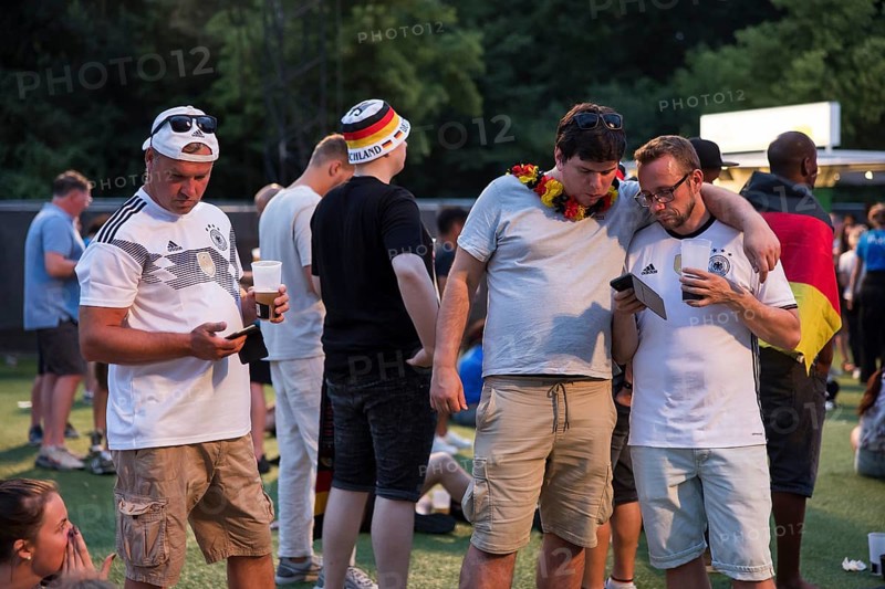 Fassball fans celebrate and gather information in the fan zone at the Brandenburg Tor after the interruption of the round of 16 match between Germany and Denmark due to a thunderstorm over the stadium in Dortmund, Berlin, 29 June 2024
