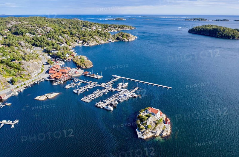 Aerial view of marina and single house on an island, southern norwegian coast, east of Kragerø, oil spill on water surface, Norway, Europe