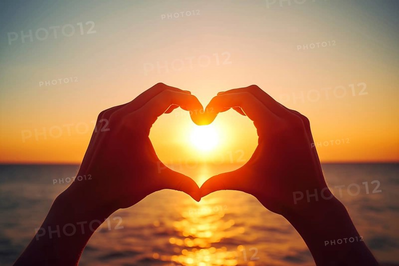 Two hands forming a heart shape, silhouetted against a breathtaking ocean sunset. Love and warmth on Valentine's Day or any romantic occasion, AI generated