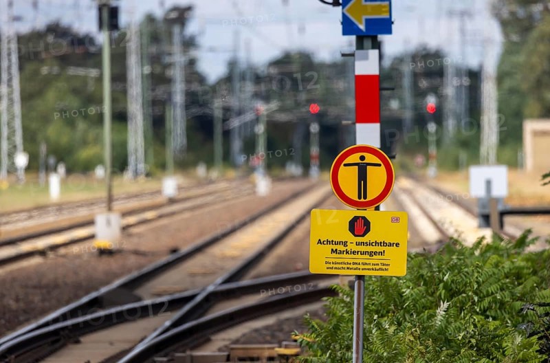 Deutsche Bahn AG warning sign for cable thieves: Attention, invisible markings against theft. Doberlug-Kirchhain railway station, Brandenburg, Germany, Europe