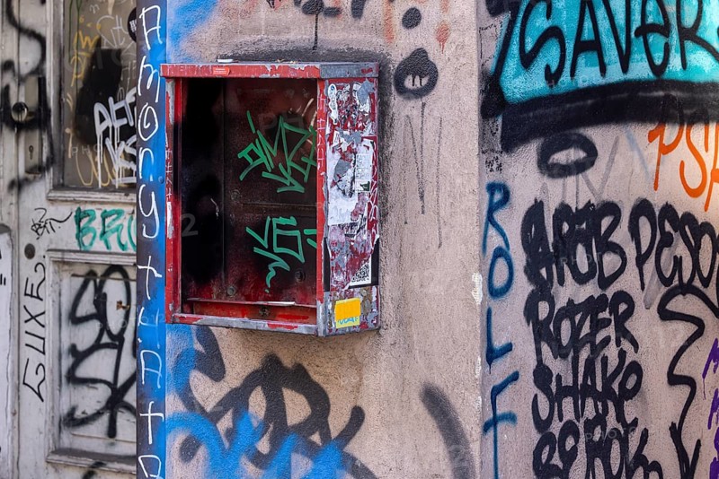 Defective chewing gum machine on a building in Berlin-Mitte, graffiti on the facade of a building. Berlin, Germany, Europe