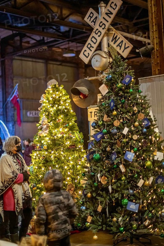 St. Thomas, Ontario Canada - Decorated Christmas trees and railway crossing are on display at the Elgin County Railway Museum.