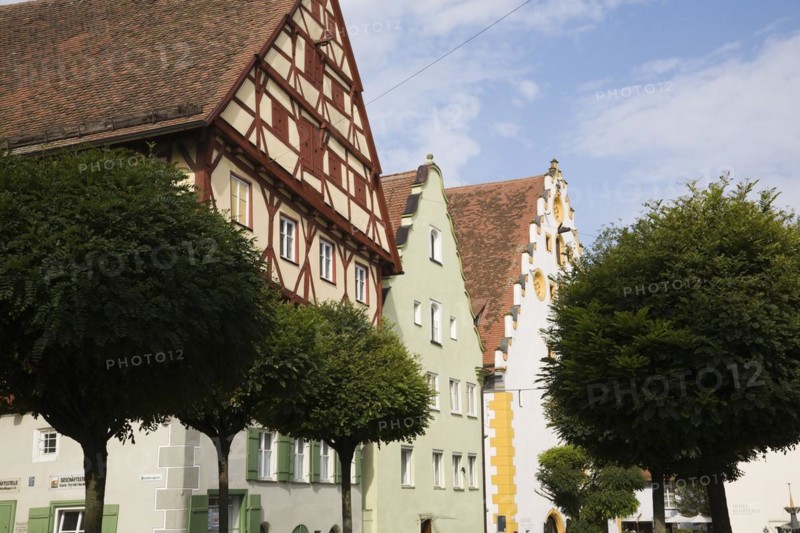 Multi storied apartment buildings with traditional terracotta ceramic tiled rooftops in medieval town of Nordlingen, Bavaria, Germany, Europe