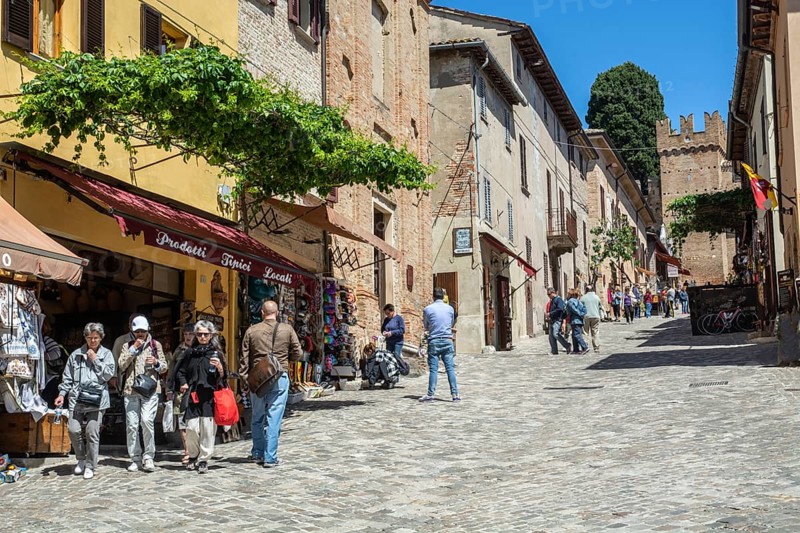 People on the central street in the medieval Gradara Castle, Marche, Italy, Europe
