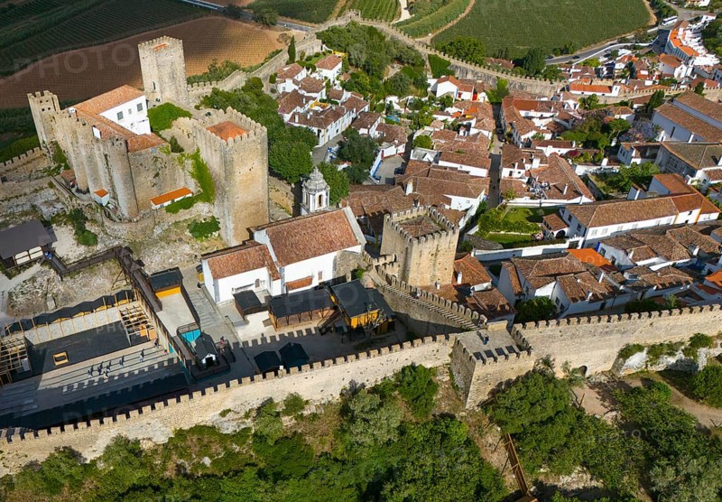 Aerial view of a historic city with a castle and surrounding city walls, embedded in a hilly and green landscape, City, Castle, Castelo de Óbidos, City wall, Óbidos, Obidos, Oeste, Centro, Estremadura, Portugal, Europe