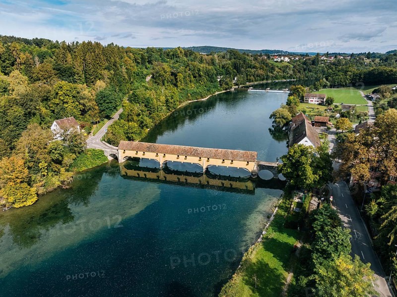 Aerial view of the covered Rhine bridge connecting the Swiss municipality of Rheinau and the German municipality of Altenburg. The bridge is one of the now rare Pfahljoch bridges in the canton of Zurich, Switzerland, Europe