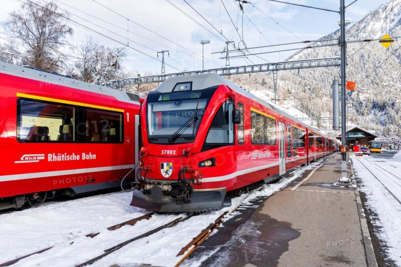Rhaetian Railway trains on the Albula railway Stadler Rail passenger train at Filisur station, Switzerland, Europe