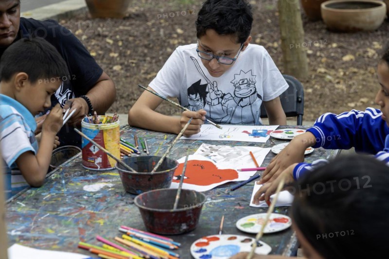 Oaxaca, Mexico, Students painting at a temporary art class in the zocalo, Central America