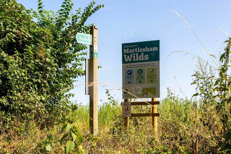 Sign for Martlesham Wilds, Suffolk Wildlife Trust farmland rewilding project, near Woodbridge, Suffolk, England, UK