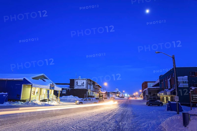 Snowy road, city, cars, buildings, cold, snow, twilight, moonlight, Arctic, Inuit settlement, Inuvik, Northwest Territories, Canada, North America