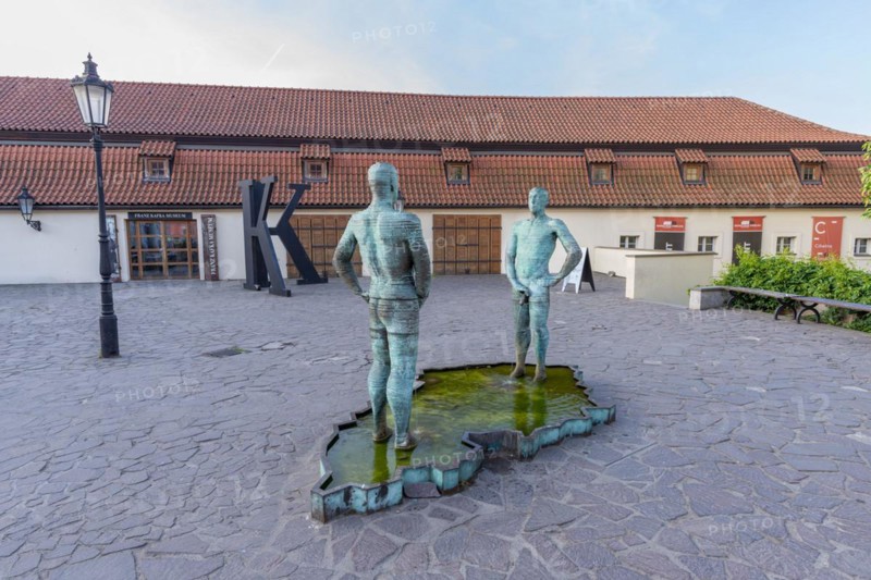 Two male figures peeing, sculpture by the artist David Cerny in front of the Franz Kafka Museum, Prague, Czech Republic, Europe