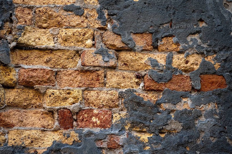 Grey plaster crumbling from a dilapidated brick wall, Venice, Veneto, Italy, Europe