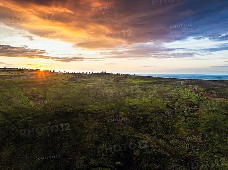 Sunset over Cod Beck Reservoir from a drone, North York Moors National Park, North Yorkshire, England, United Kingdom, Europe