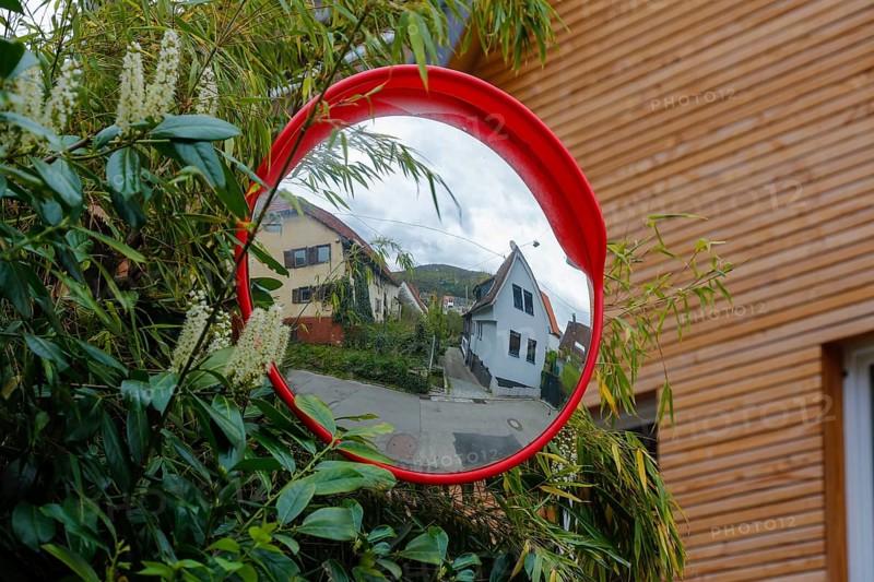 Traffic mirror, reflection, residential area, houses, Gönningen, district of Reutlingen, Baden-Württemberg, Germany, Europe