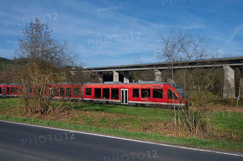 Regional train in the Schnaittach valley, on the right the motorway bridge of the A9 spans the Schnaittach valley, Schnaittach, Middle Franconia, Bavaria, Germany, Europe