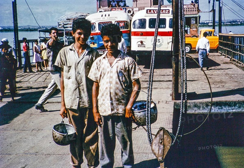 Two boys on board a car ferry crossing the Rio Magdalena river to Barranquilla, Colombia, South America, 1961, South America