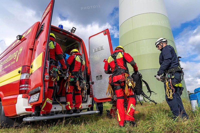 Height rescuers from the Gelsenkirchen fire brigade practise abseiling from a wind turbine from a height of 110 metres after rescuing an accident victim from the nacelle, Gladbeck, North Rhine-Westphalia, Germany, Europe