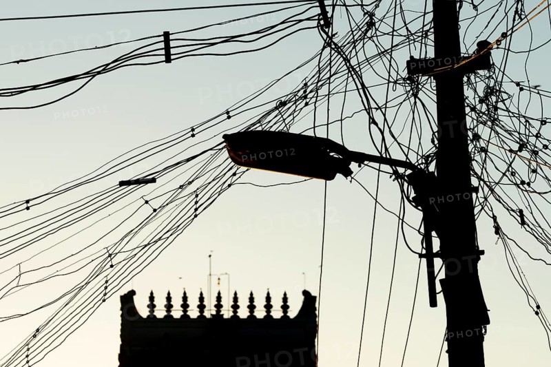High-voltage power lines, tangle of cables, temple gopura or temple tower, Rameswaram or Rameshwaram, Pamban Island, Tamil Nadu, India, Asia