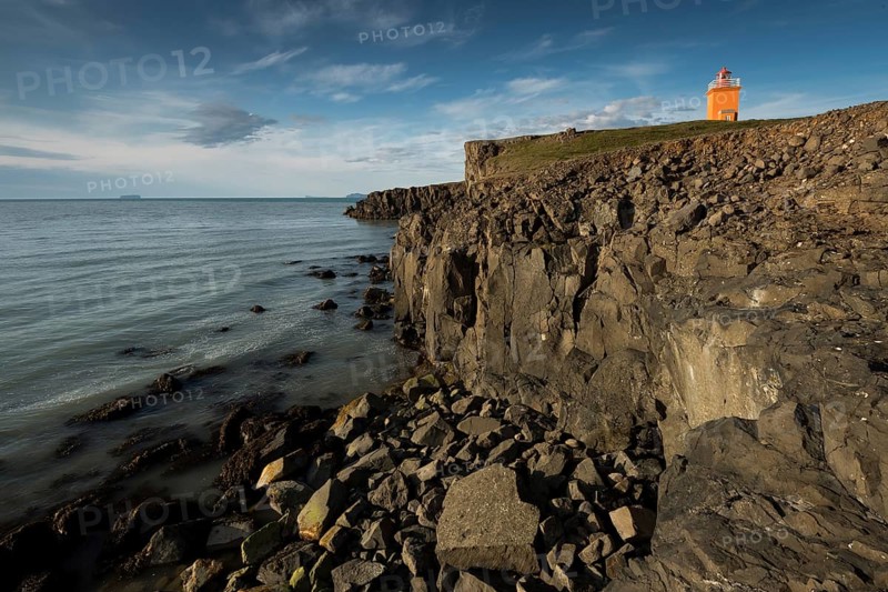 Rocky coast, lighthouse Hegranesviti, Hegranes, peninsula Landsendi, in the background island Drangey, near Sauðárkrokur, Skagafjörður, Iceland, Europe