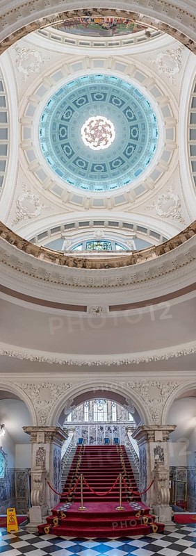 Magnificent interior with red and gold staircase and imposing domed ceiling, Belfast