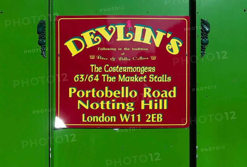 Sign for fruit and vegetable shop Devlin's, Portobello Road, Notting Hill, London, England, Great Britain