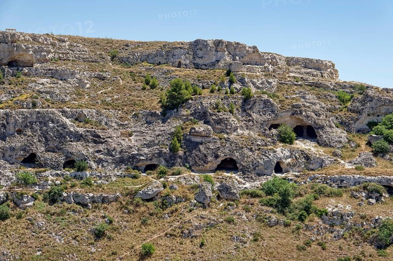 Ancient caves of Matera at the Gravina Gorge. There are around 3000 cave dwellings in Matera, dug into the tuff. The cave settlements, Sassi, are a UNESCO World Heritage Site. Matera, Basilicata, Southern Italy, Southern Europe