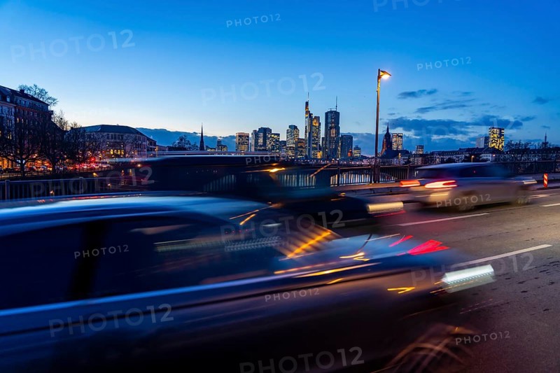 Skyline of the city centre of Frankfurt am Main, road traffic, car, on the raft bridge, dusk, river Main, winter, Hesse, Germany, Europe