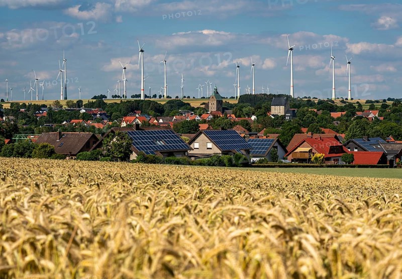 Wind farm near the East Westphalian town of Energiestadt Lichtenau, many residential buildings with photovoltaic systems on the roofs, over 80 wind turbines on this hill, in total there are more than 200 wind turbines around the town, producing 9 times more electricity than the town itself consumes, the rest is fed into the grid, North Rhine-Westphalia, Germany, Europe