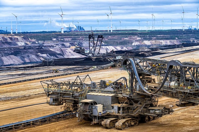 Opencast lignite mine Garzweiler 2, bucket wheel excavator 261 excavating the surface, at the rest of the hamlet of Lützerath, behind excavator 288, mining lignite, Neurath lignite-fired power station, wind farm, Erkelenz, North Rhine-Westphalia, Germany, Europe