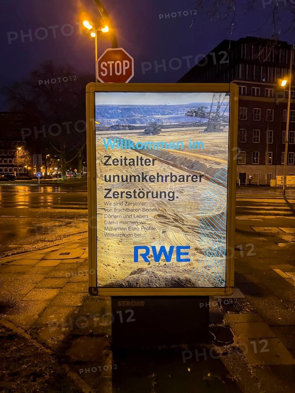 Alleged advertising poster of the energy company RWE, which professes the environmental destruction caused by lignite mining, presumably placed by environmental activists, Essen, North Rhine-Westphalia, Germany, Europe