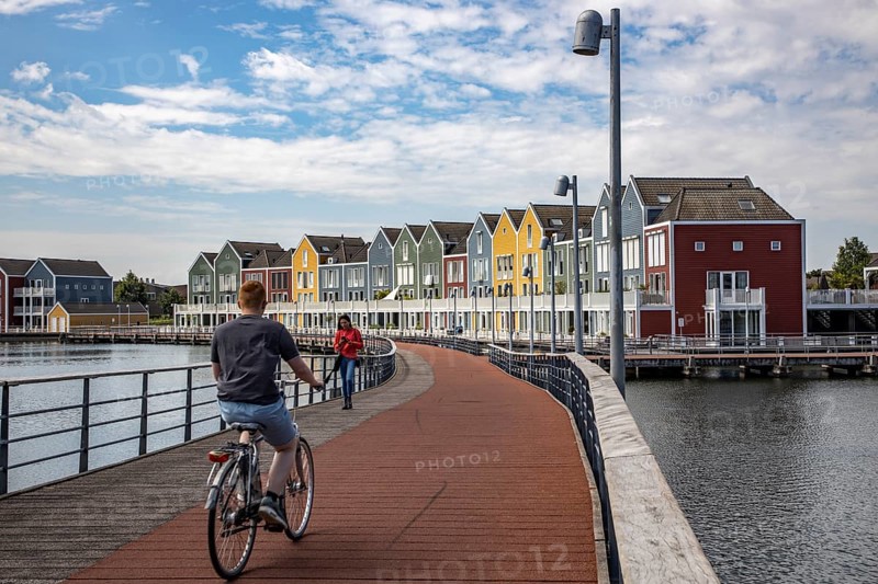 Small town of Houten near Utrecht, bicycles have priority in the town of 50, 000 inhabitants, generous cycle paths, many leisure areas, water areas, living by the water