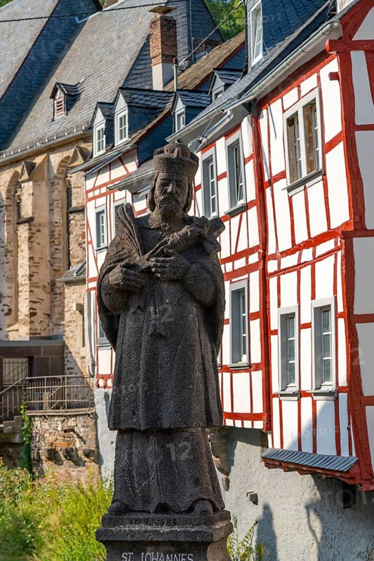 Monreal, idyllic half-timbered village in the Elz valley, figure of Nepomuk, the bridge saint, in the district of Mayen-Koblenz in Rhineland-Palatinate, Germany, Europe