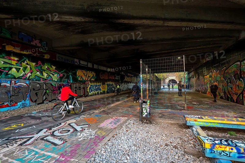 The Nordbahntrasse, a cycle path, footpath, on a former 22 km long railway line, along the west-east axis of Wuppertal, on the northern slope, with many tunnels, viaducts and views of the city, graffiti and basketball area at Brill, Wuppertal, North Rhine-Westphalia, Germany, Europe