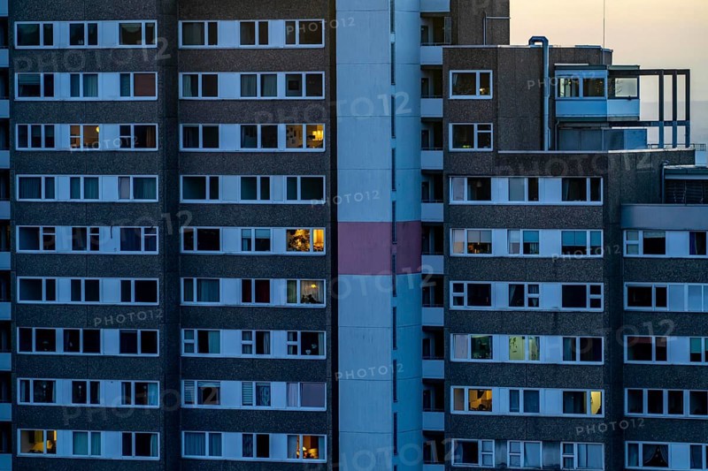 High-rise buildings in the Bensberg residential park, Bergisch-Gladbach, 18-storey housing estate with over 900 flats spread over 7 building complexes, dusk, illuminated windows, North Rhine-Westphalia, Germany, Europe