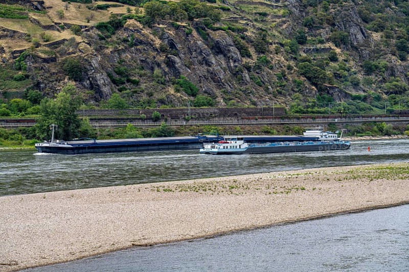 Cargo ship, tanker, on the Rhine in the Upper Middle Rhine Valley, sandbank in the Rhine, due to low water level, near Oberwesel, Rhineland-Palatinate, Germany, Europe
