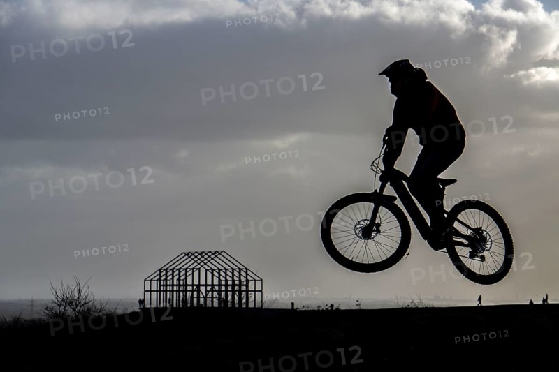 Mountain bike trail with jumps, downhill trail, on the Norddeutschland spoil tip in Neukirchen-Vluyn, a mining spoil tip, today a landscape park, hall house, art building, landmark, North Rhine-Westphalia, Germany, Europe