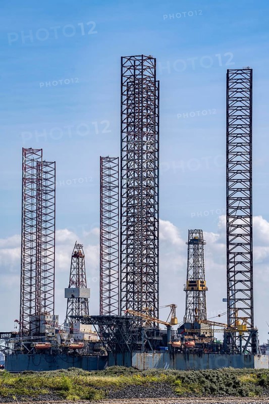 Oil and gas production platforms, drilling rigs being repaired, converted, modernised in the port area of Vlissingen-Oost, Netherlands