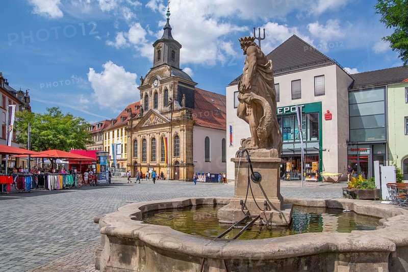 Neptune fountain with hospital church on the pedestrianised Maximilianstrasse in the old town, Bayreuth, Upper Franconia, Franconia, Bavaria, Germany, Europe