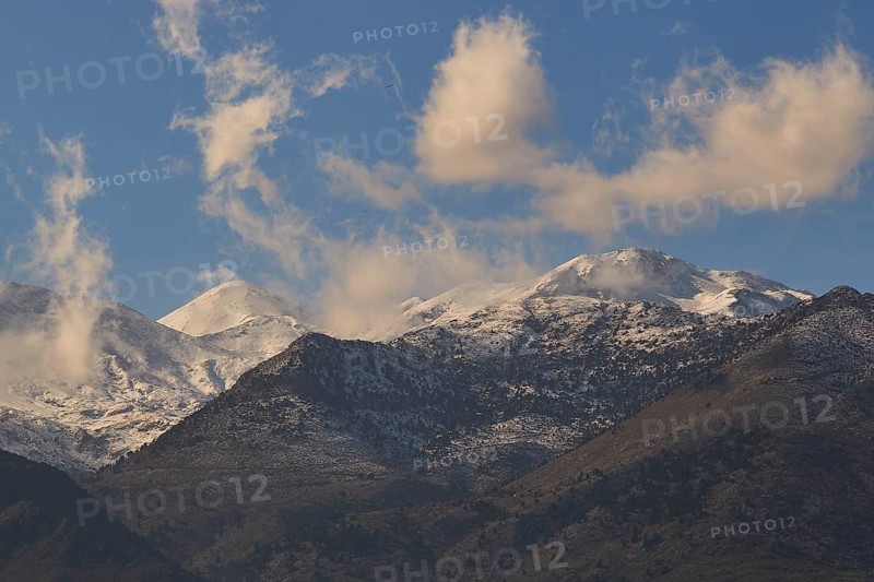 Cloudy mountain landscape with snow-capped peaks under a clear sky, Lefka Ori, White Mountains, Mountain massif, West, Crete, Greece, Europe