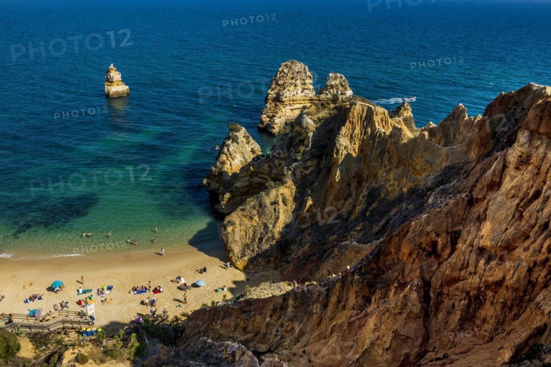 Rocky coast with beach and red rocks, Praia do Camilo, Lagos, Algarve, Portugal, Europe