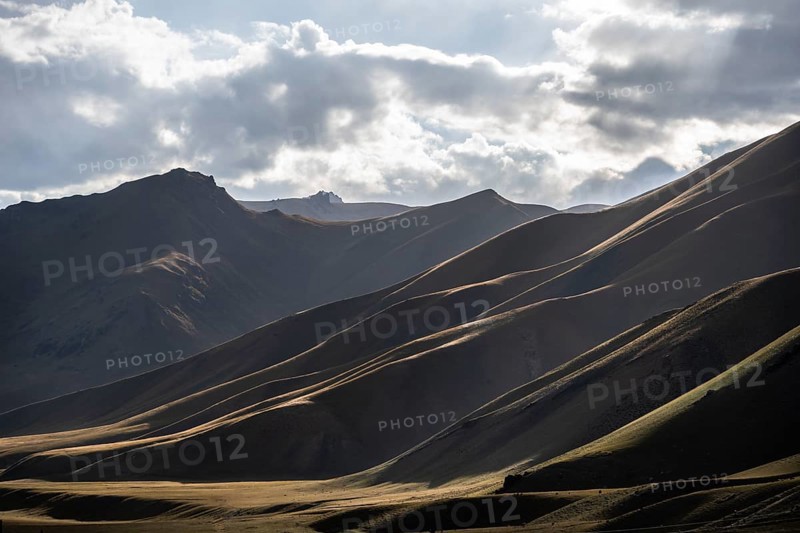 Mountain silhouette and hills in the sunlight, Dramatic mountain landscape, Tian Shan, Sky Mountains, Sary Jaz Valley, Kyrgyzstan, Asia