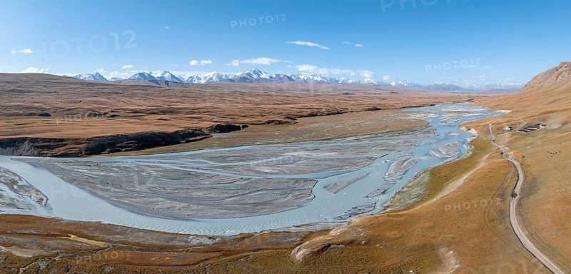 Aerial view, Burkhan mountain valley with meandering river, barren dramatic mountain landscape, Terskey Ala-Too, Tien Shan, Issyk Kul province, Kyrgyzstan, Asia