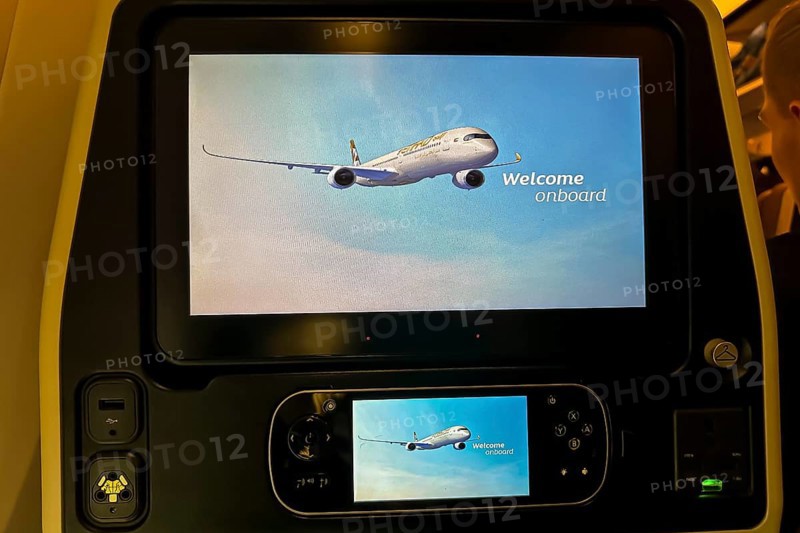 Aircraft of the airline Etihad, interior with monitor for the passenger with the text welcome onboard. Boeing 787 aircraft, Abu Dhabi, United Arab Emirates, UAE, Asia
