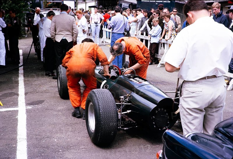 Graham Hill BRM P261 race car mechanic at work, Grand Prix of Belgium 1964, Spa, Belgium, Raymond Mays in the background, Europe