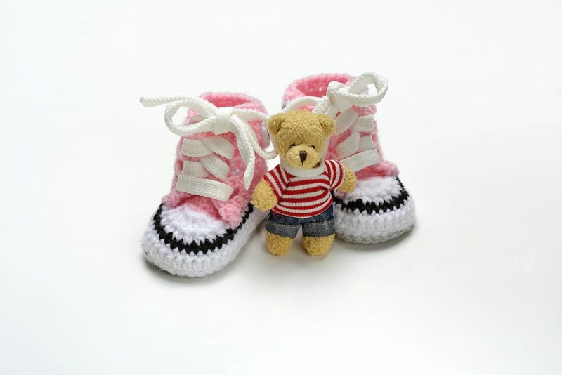 Pink baby shoes with teddy bear