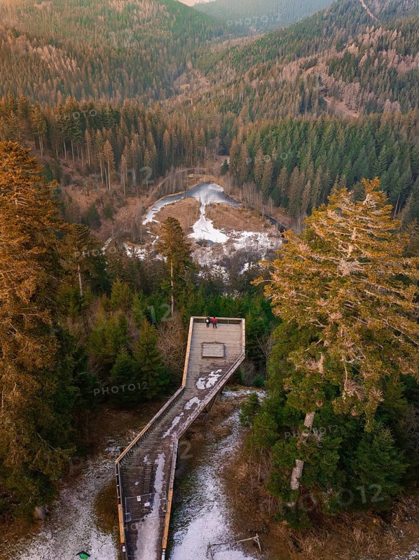 Snow-covered wooden platform surrounded by forest with panoramic view, Ellbachseeblick viewing platform, Baiersbronn, Black Forest, Germany, Europe