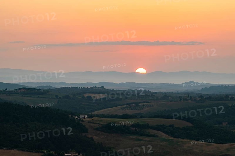 View from Montepulciano into a typical Tuscan landscape in Val d'Orcia with hills, trees, fields, cypresses and farm houses in summer, Montepulciano, Tuscany, Italy, Europe