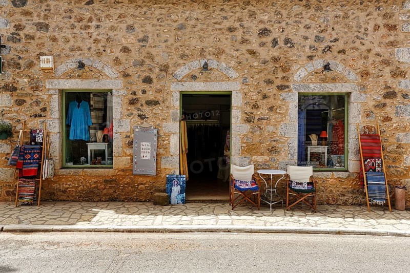 Façade with souvenir shop, typical stone house in Stoupa, former fishing village, Mani, Greece, Europe